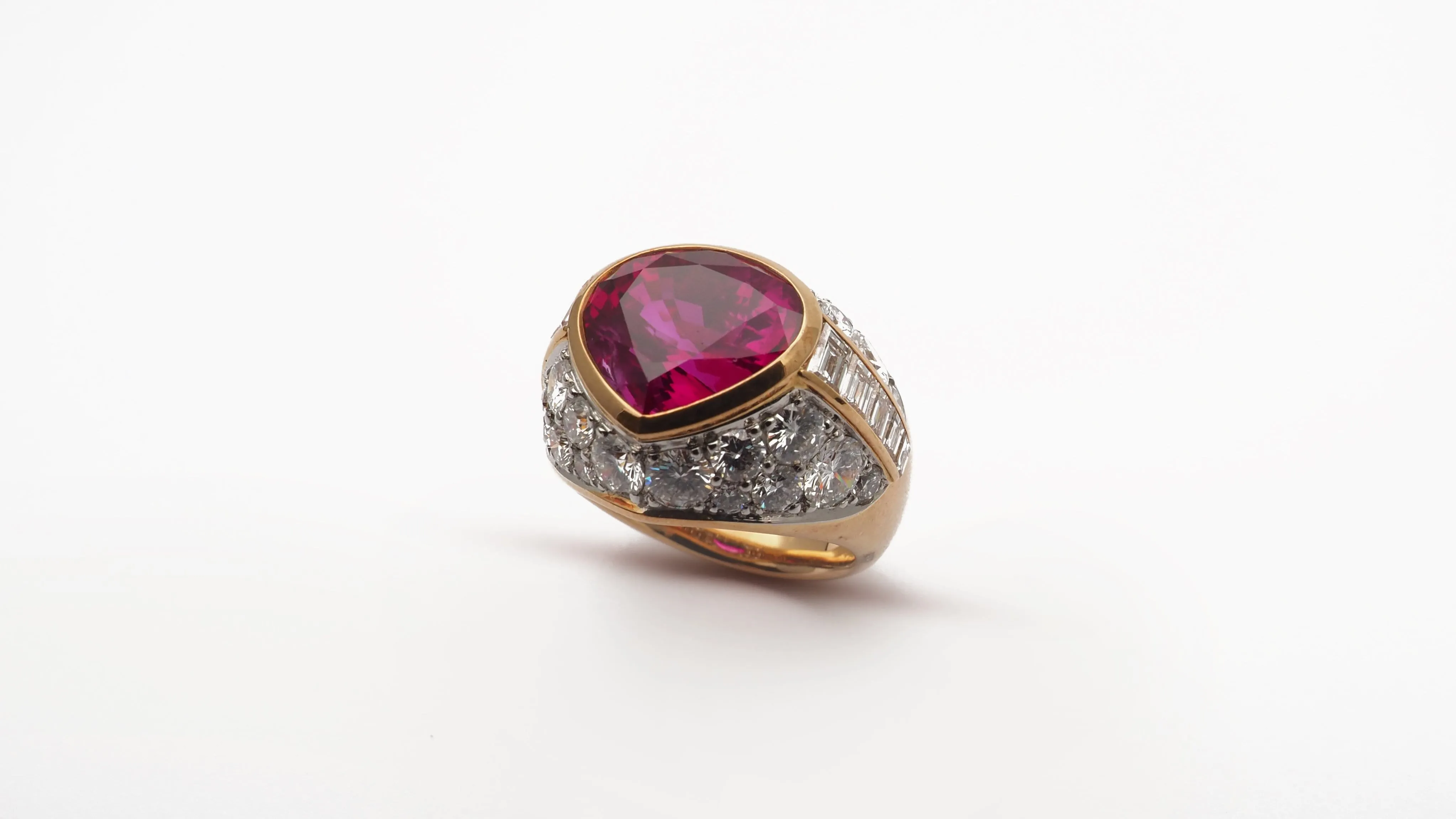 Burma Ruby in an 18k Yellow gold Ring 7.23ct with diamonds.